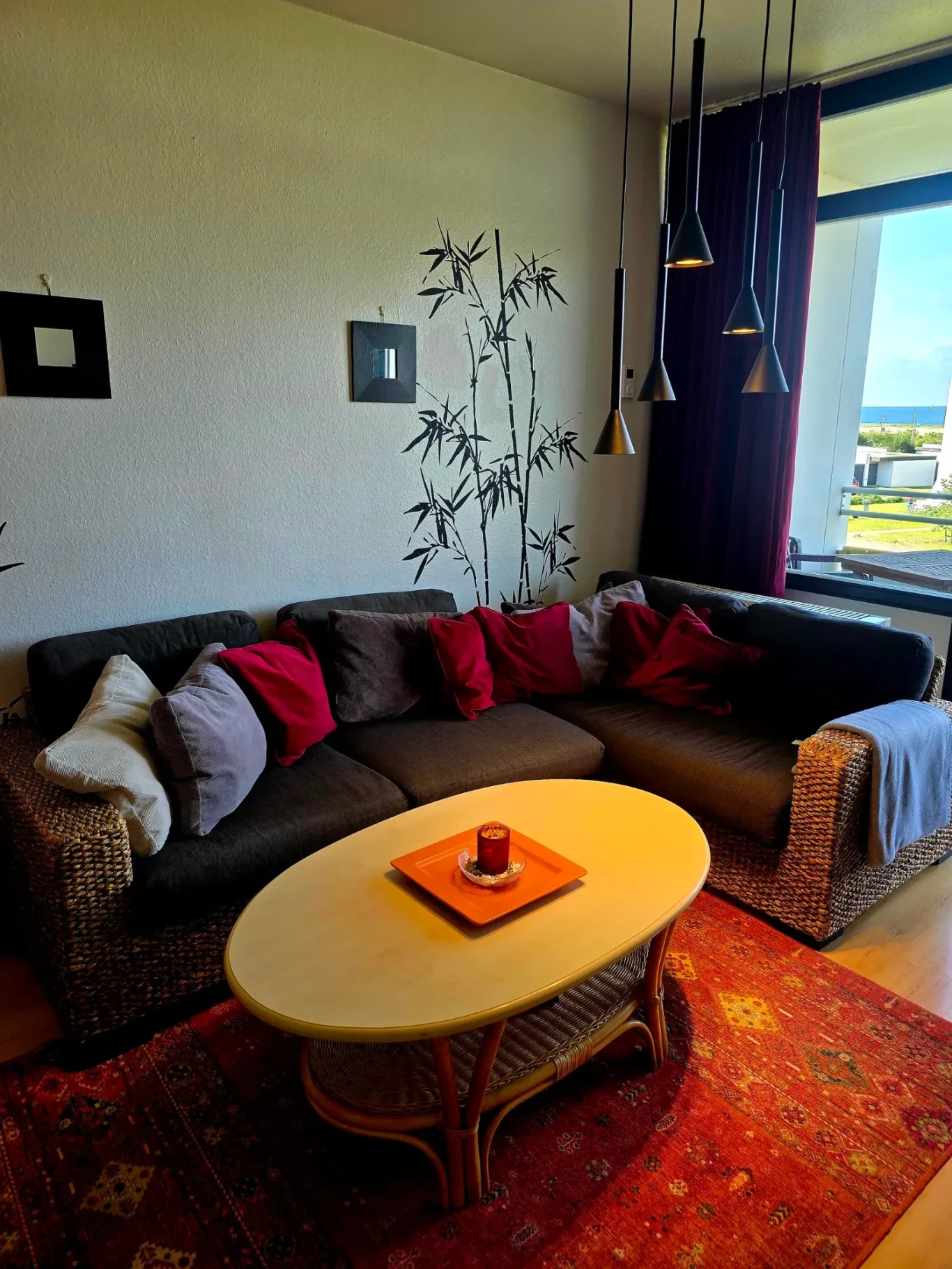 Wohn-/Schlafzimmer Wohnzimmer mit Sofa in Ferienwohnung am Südstrand Fehmarn