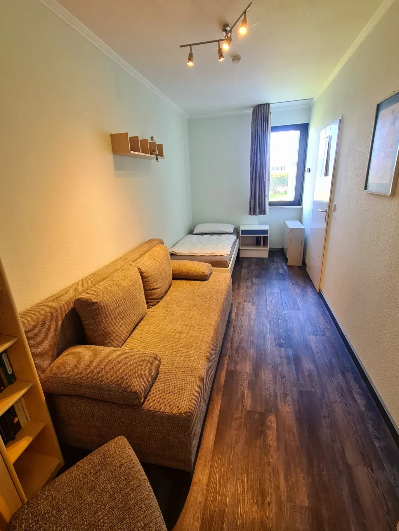 sep. Schlafzimmer Schlafzimmer mit Schlafsofa in Ferienwohnung auf Fehmarn