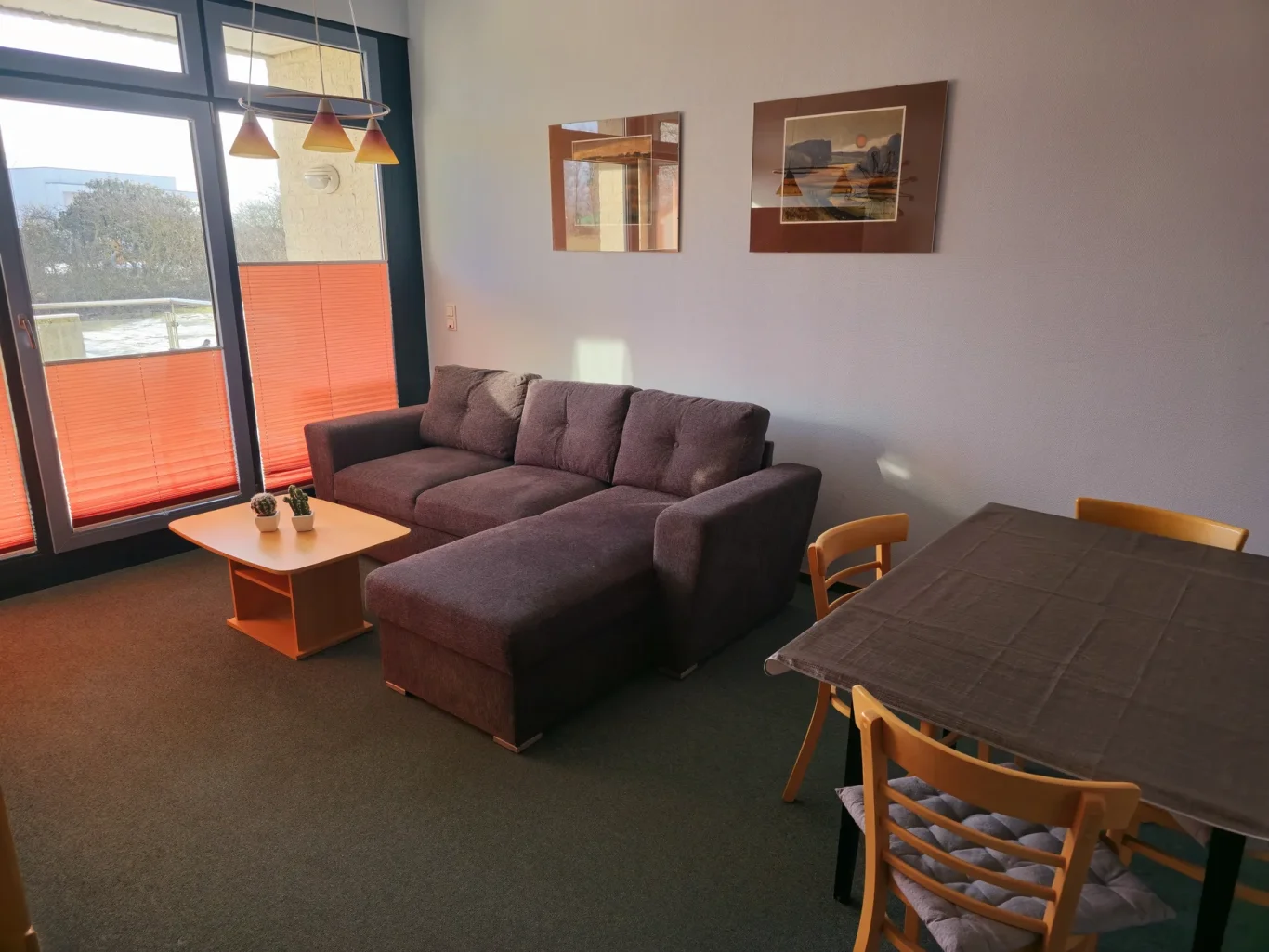 Wohnzimmer Wohnzimmer mit Sofa in Ferienwohnung am Südstrand Fehmarn